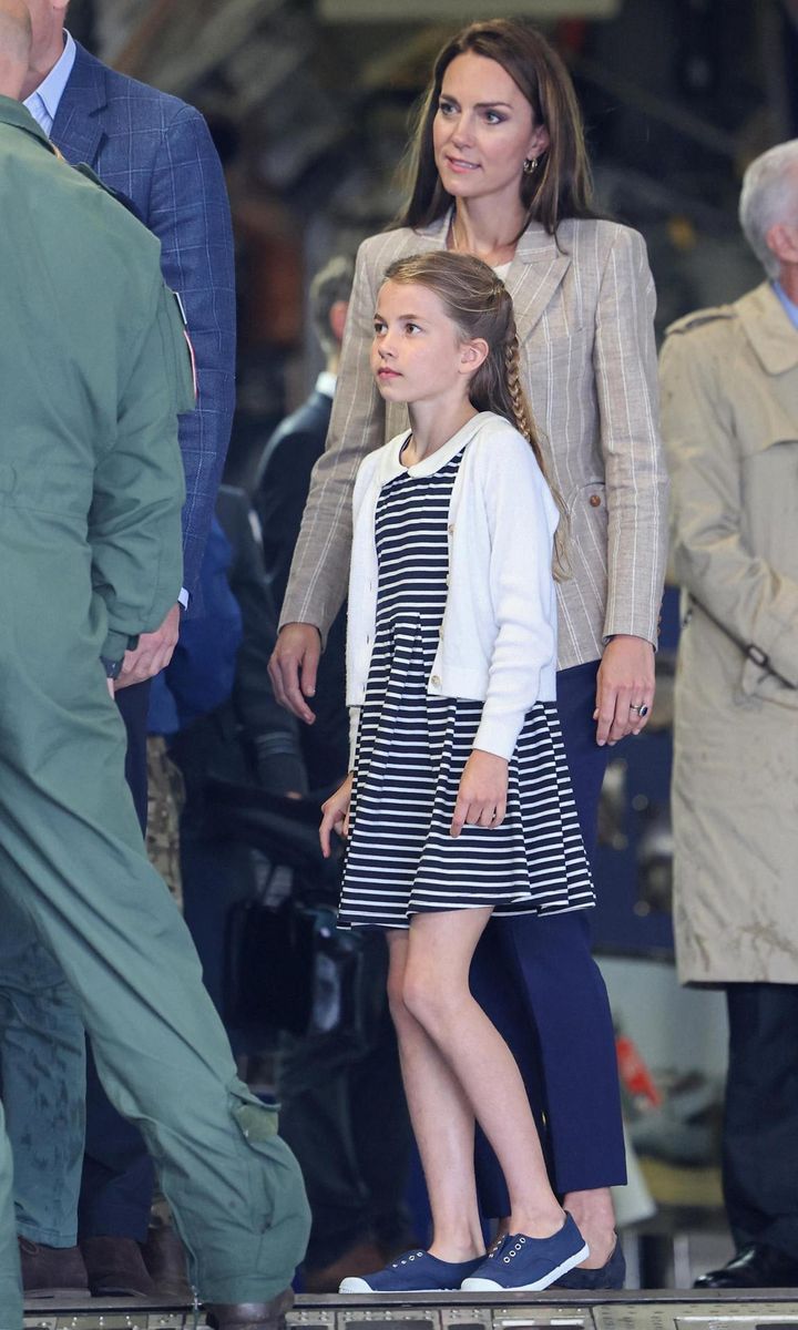 Meanwhile, Princess Charlotte recycled the striped Rachel Riley dress that she wore last summer to the Birmingham 2022 Commonwealth Games. This time around, the Prince and Princess of Wales' daughter teamed the summer frock with a white cardigan