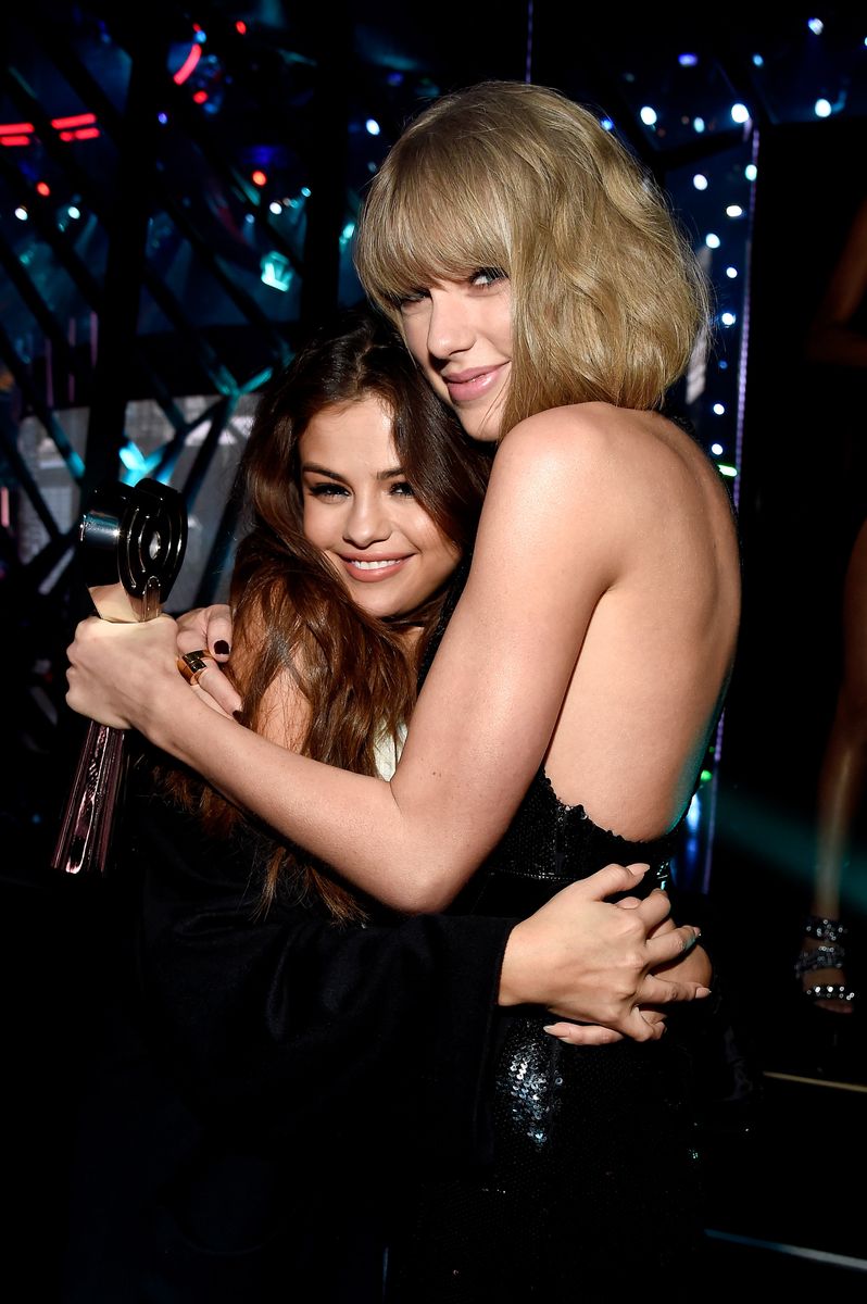 INGLEWOOD, CALIFORNIA - APRIL 03:  Singer Taylor Swift (R), winner of the Album of the Year award for '1989,' embraces actress/singer Selena Gomez backstage at the iHeartRadio Music Awards which broadcasted live on TBS, TNT, AND TRUTV from The Forum on April 3, 2016 in Inglewood, California.  (Photo by Kevin Mazur/Getty Images for iHeartRadio / Turner)