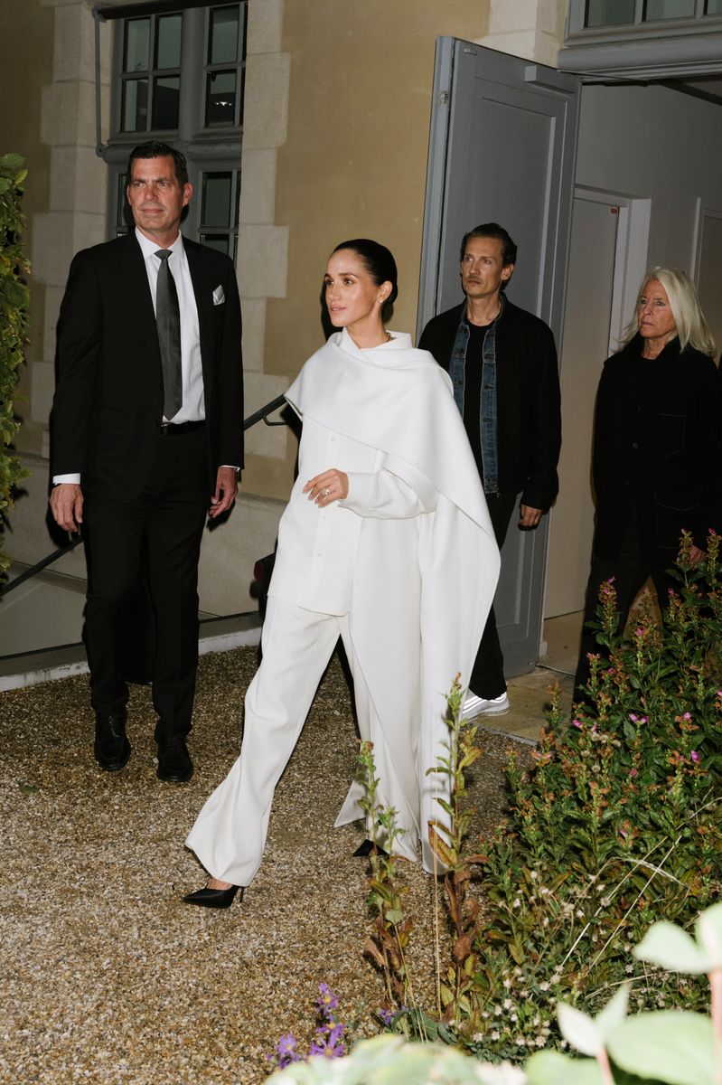 The Duchess of Sussex returned to Europe this weekend with a completely unexpected appearance at Paris Fashion Week after three years away from the continent