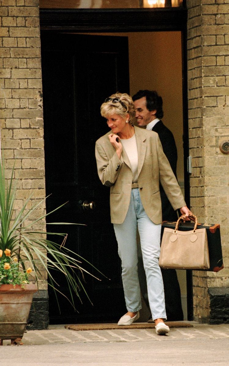 Lady Diana in 1996 wearing jeans and jacket look outside Eton College
