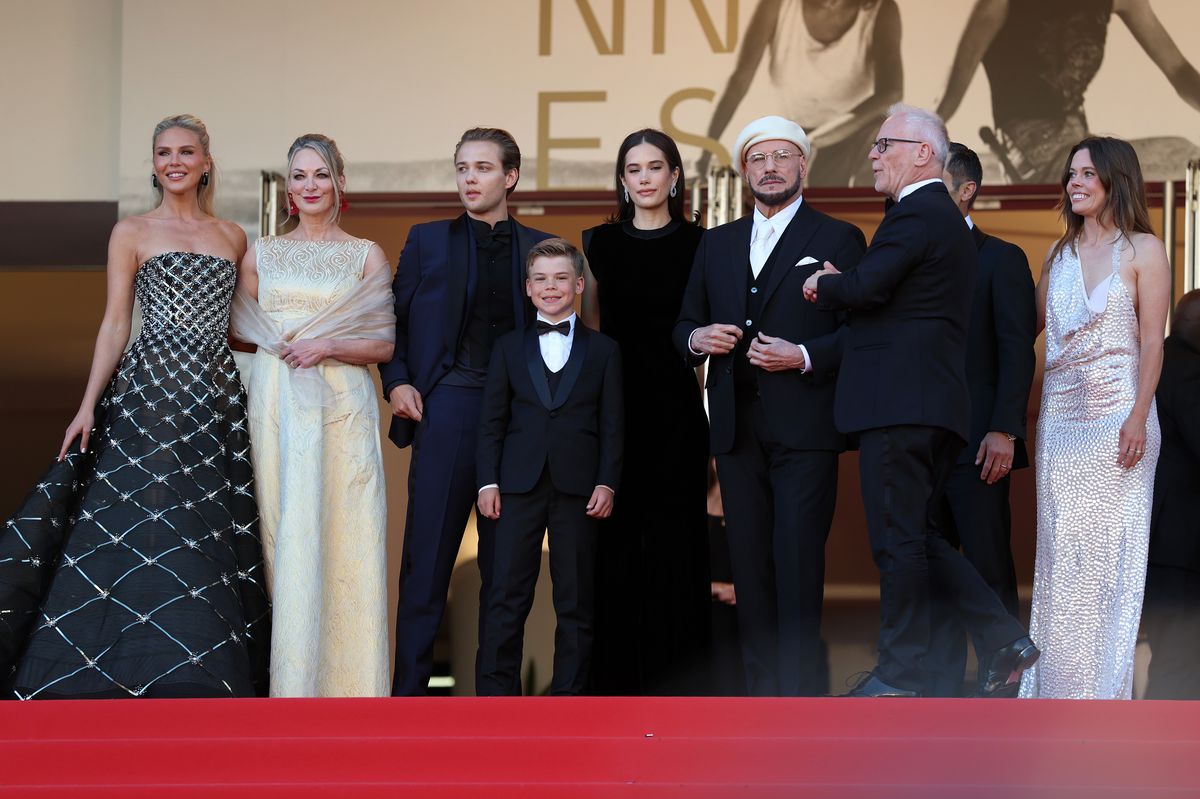 Travolta and the cast of his film attending the 'Karma' screening