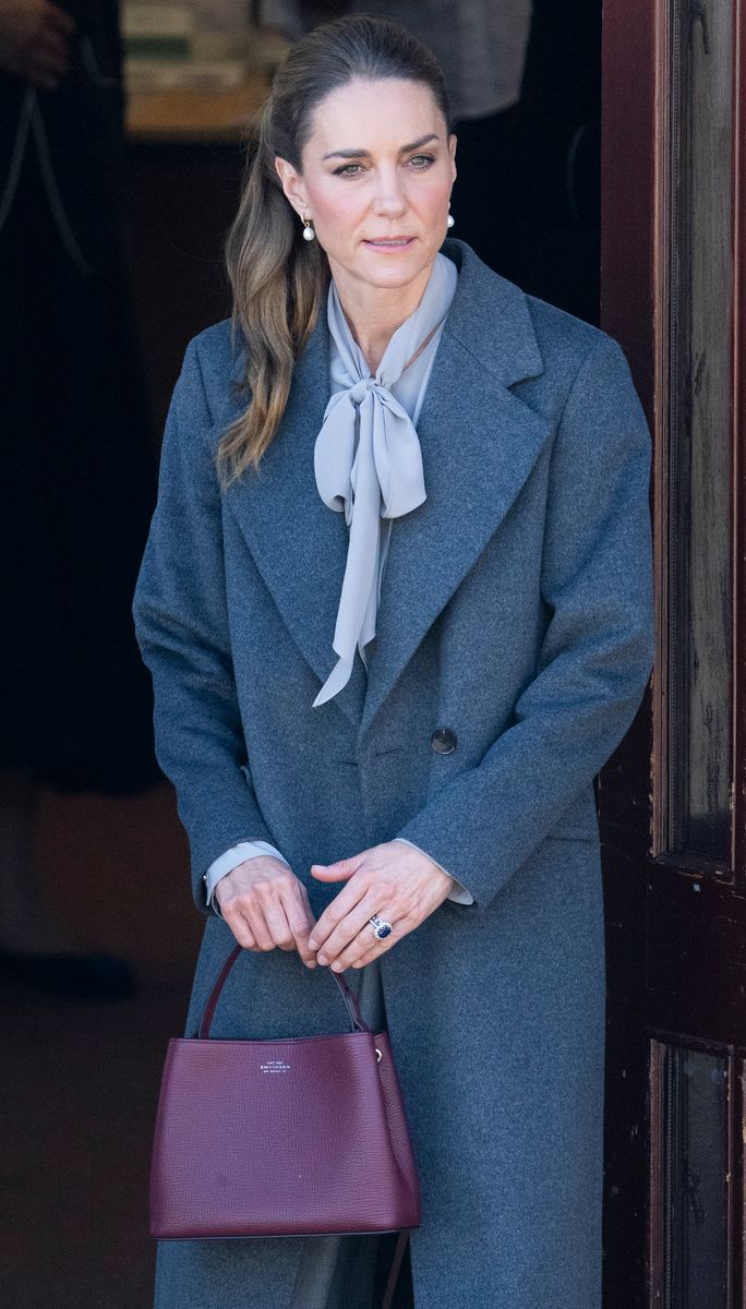 A charcoal coat, gray trousers, and a dove-gray sweater can become an entirely different outfit once you add an oxblood loafer or burgundy handbag.