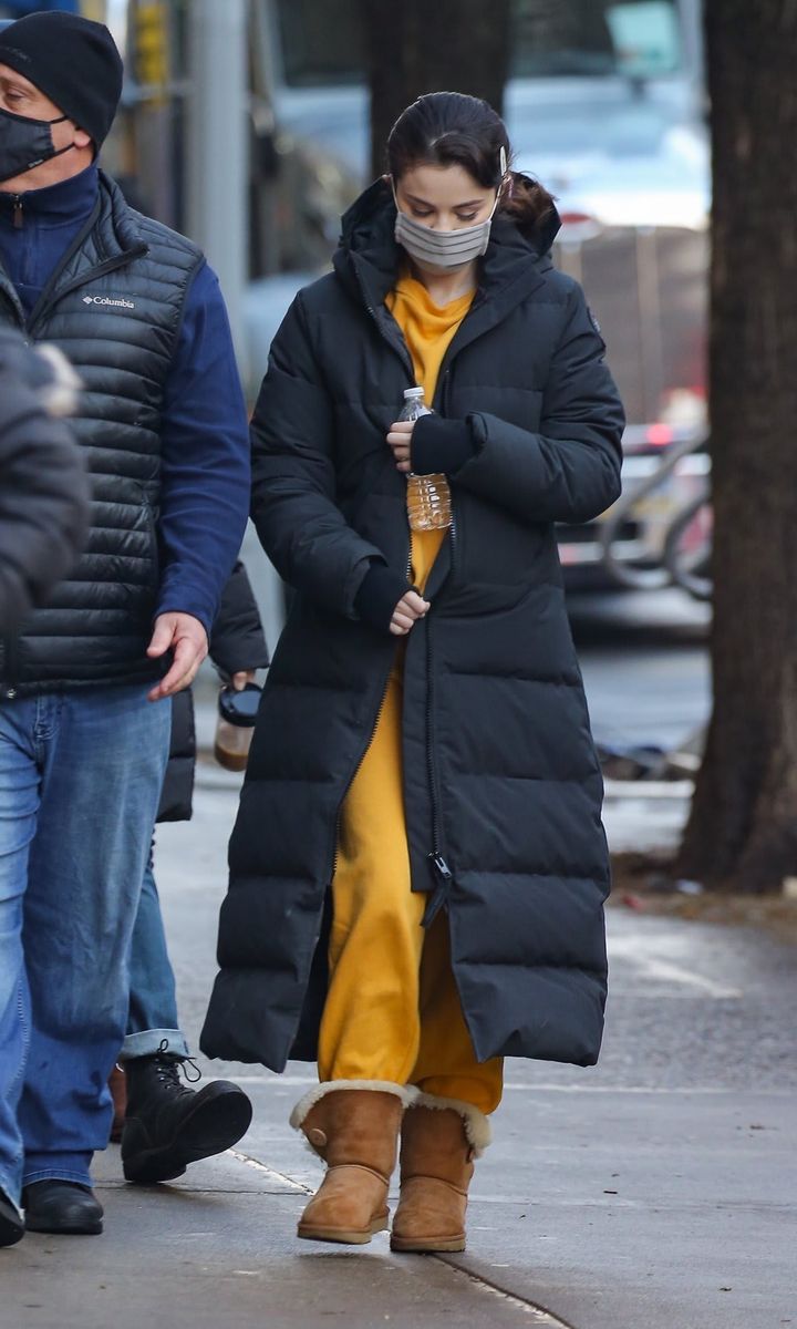Selena Gomez in NYC yellow outfit and a Canada Goose long coat on the set of 'Only Murders in the Building' in New York.