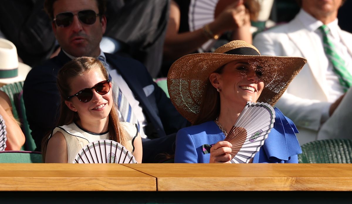 LONDON, ENGLAND - JULY 13: Princess Charlotte of Wales and Catherine, Princess of Wales, Patron of The AELTC fan themselves in the Royal Box during the Gentleman's Singles Final between Jannik Sinner of Italy and Carlos Alcaraz of Spain on day fourteen of The Championships Wimbledon 2025 at All England Lawn Tennis and Croquet Club on July 13, 2025 in London, England. (Photo by Julian Finney/Getty Images)