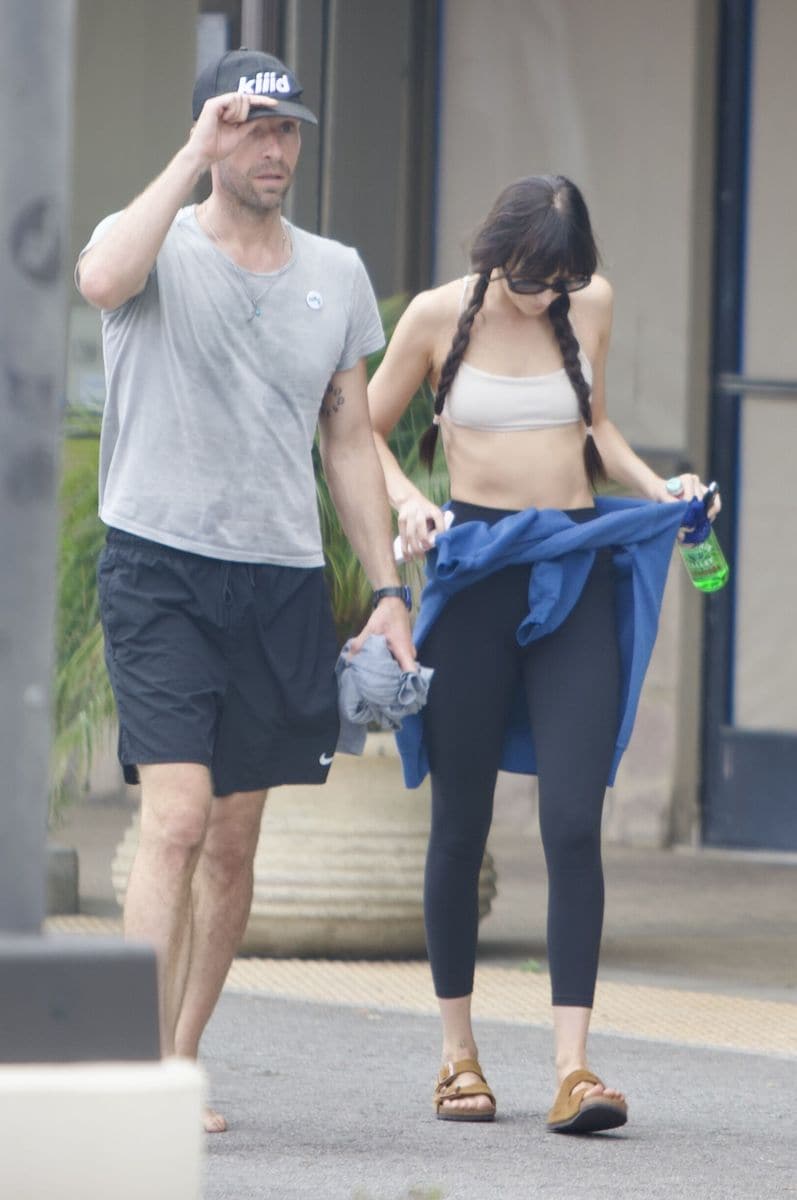Chris Martina and Dakota Johnson