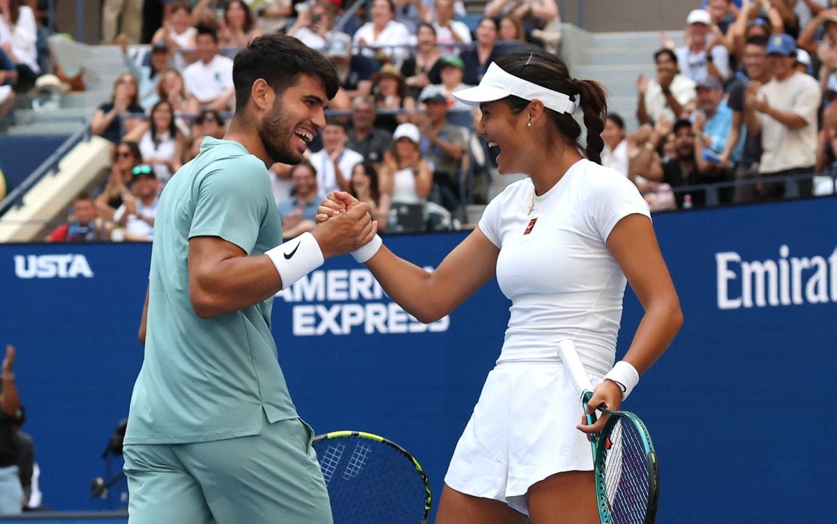 Emma Raducanu and Carlos Alcaraz celebrate a point during their first-round mixed doubles match against Jessica Pegula and Jack Draper,