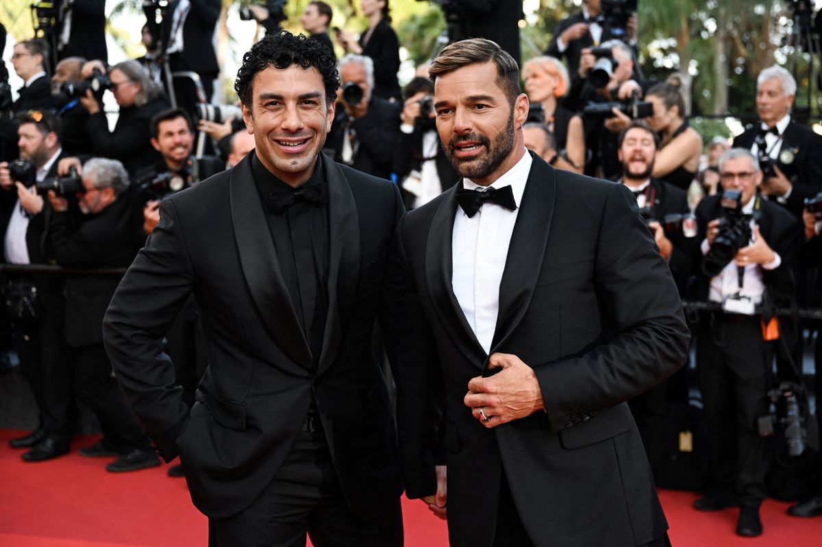 Puerto Rican singer Ricky Martin and his husband Jwan Yosef arrive for the screening of the film "Elvis" during the 75th edition of the Cannes Film Festival in Cannes, southern France, on May 25, 2022. (Photo by CHRISTOPHE SIMON / AFP) (Photo by CHRISTOPHE SIMON/AFP via Getty Images) 