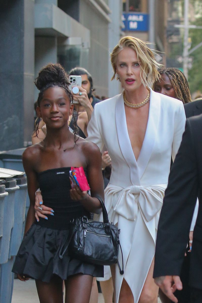Charlize Theron was joined by her daughters, August Theron and Jackson Theron, as they arrived at the New York premiere of The Odyssey at AMC Lincoln Square Theater.