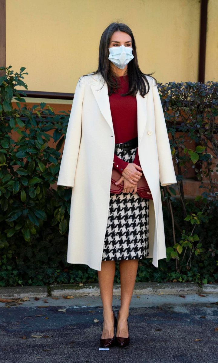 The Spanish royal served holiday fashion inspiration wearing a red sweater and houndstooth skirt
