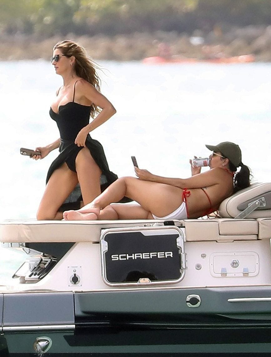 Gisele Bundchen and Joaquim Valente pack on the PDA during a boat ride with friends in Miami