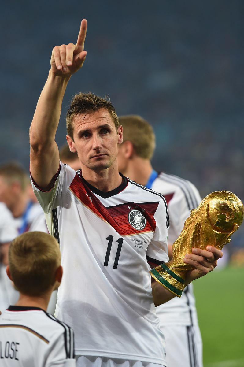 Miroslav Klose of Germany celebrates with the World Cup trophy after defeating Argentina 1-0 in extra time during the 2014 FIFA World Cup