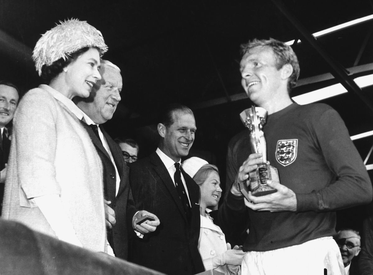Bobby Moore receives the Jules Rimet World Cup trophy from the Queen of England after beating West Germany in the final in 1966.