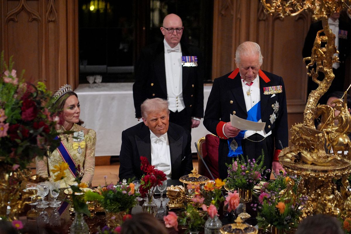 US President Donald Trump reacts as Britain's King Charles III delivers a speech during a State Banquet at Windsor Castle, in Windsor, on September 17, 2025, during the US President's second State Visit. US President Donald Trump arrived in Britain for an unprecedented second State Visit, with the UK government rolling out a royal red carpet welcome to win over the mercurial leader. (Photo by Yui Mok / POOL / AFP) (Photo by YUI MOK/POOL/AFP via Getty Images)          