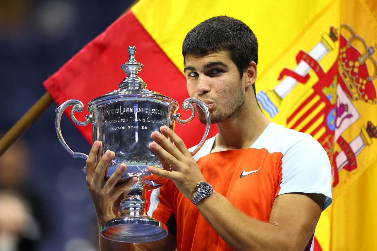 Carlos Alcaraz of Spain celebrates with the championship trophy after defeating Casper Ruud of Norway during the US Open 