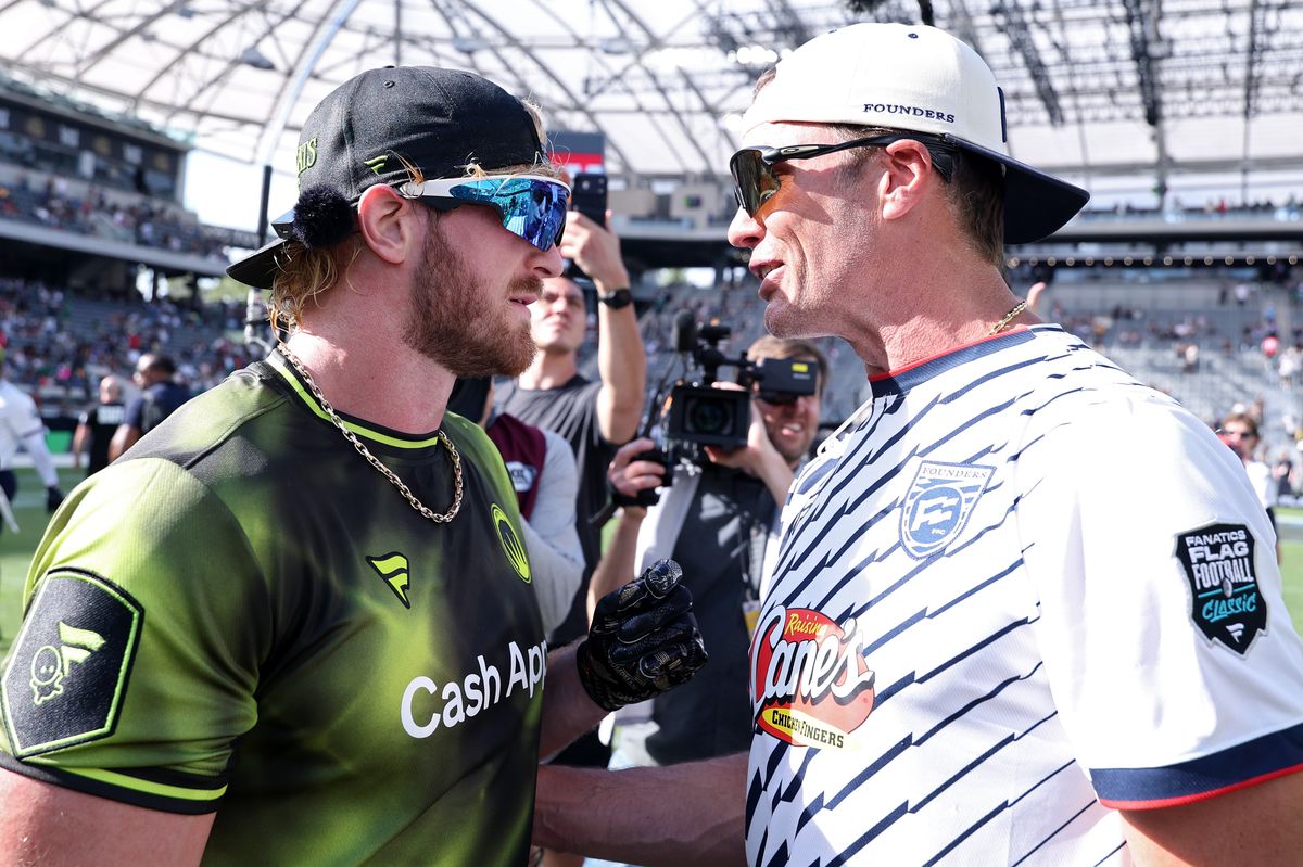Logan Paul and Tom Brady speak during the Fanatics Flag Football Classic at BMO Stadium on March 21, 2026