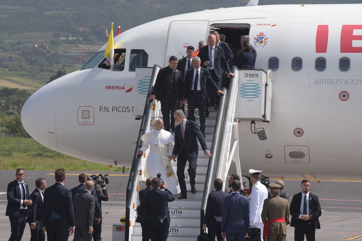 Pope Leo XIV leaves the aircraft after officials suspend takeoff due to a mechanical problem.