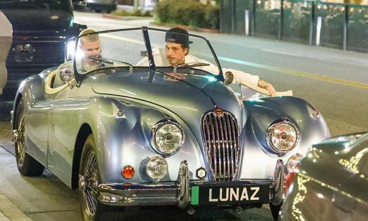 Brooklyn and Romeo Beckham were seen leaving dinner at Il Pastaio in Beverly Hills, with Brooklyn driving his custom retro blue 1956 Jaguar XK140, valued at $500k.