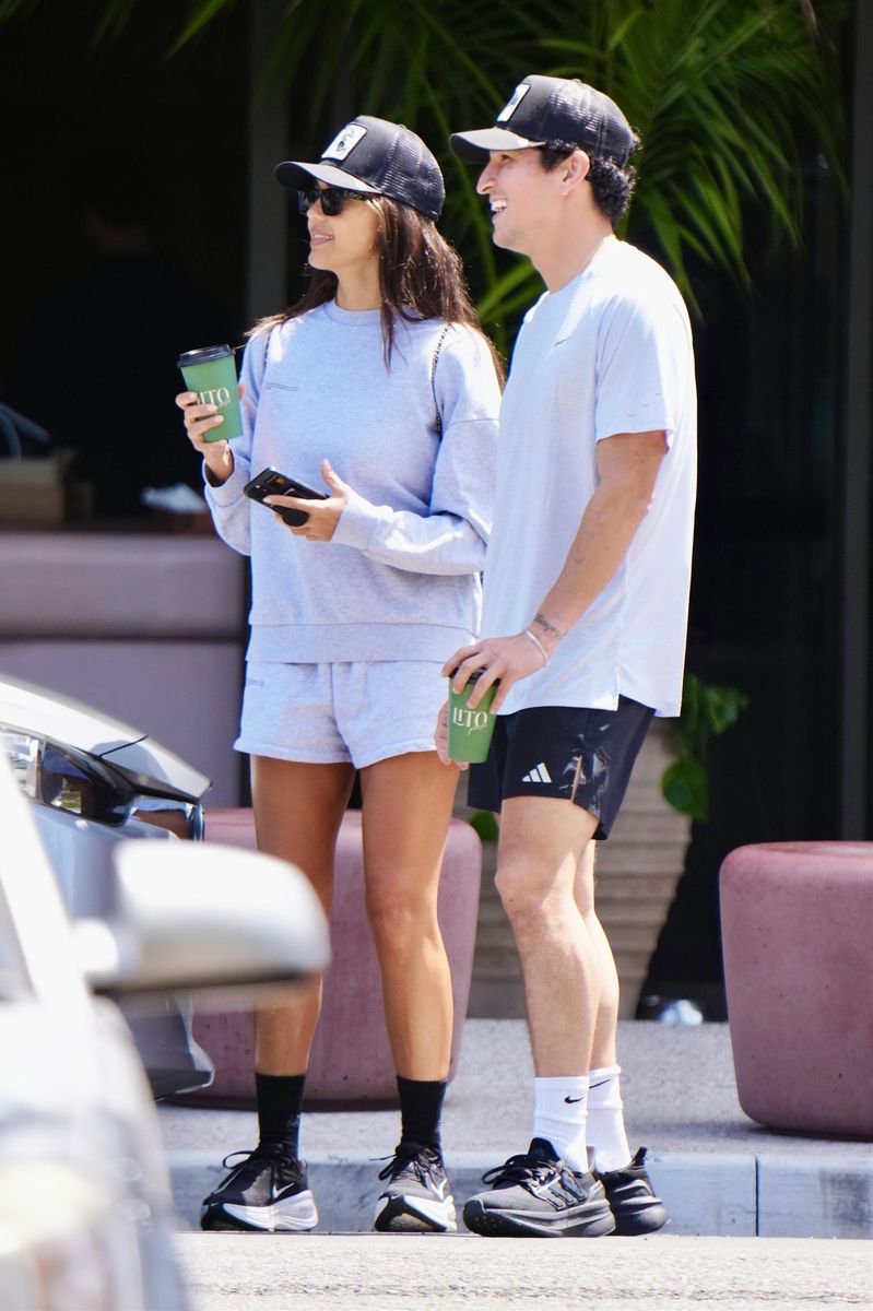 The couple appeared intimately engaged, frequently holding hands and embracing during their walk.