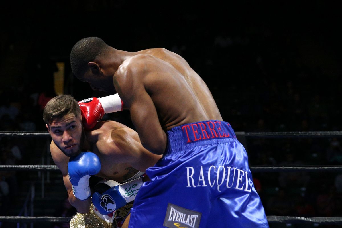 Prichard Colon (L) and Terrel Williams exchange punches in their super welterweights bout