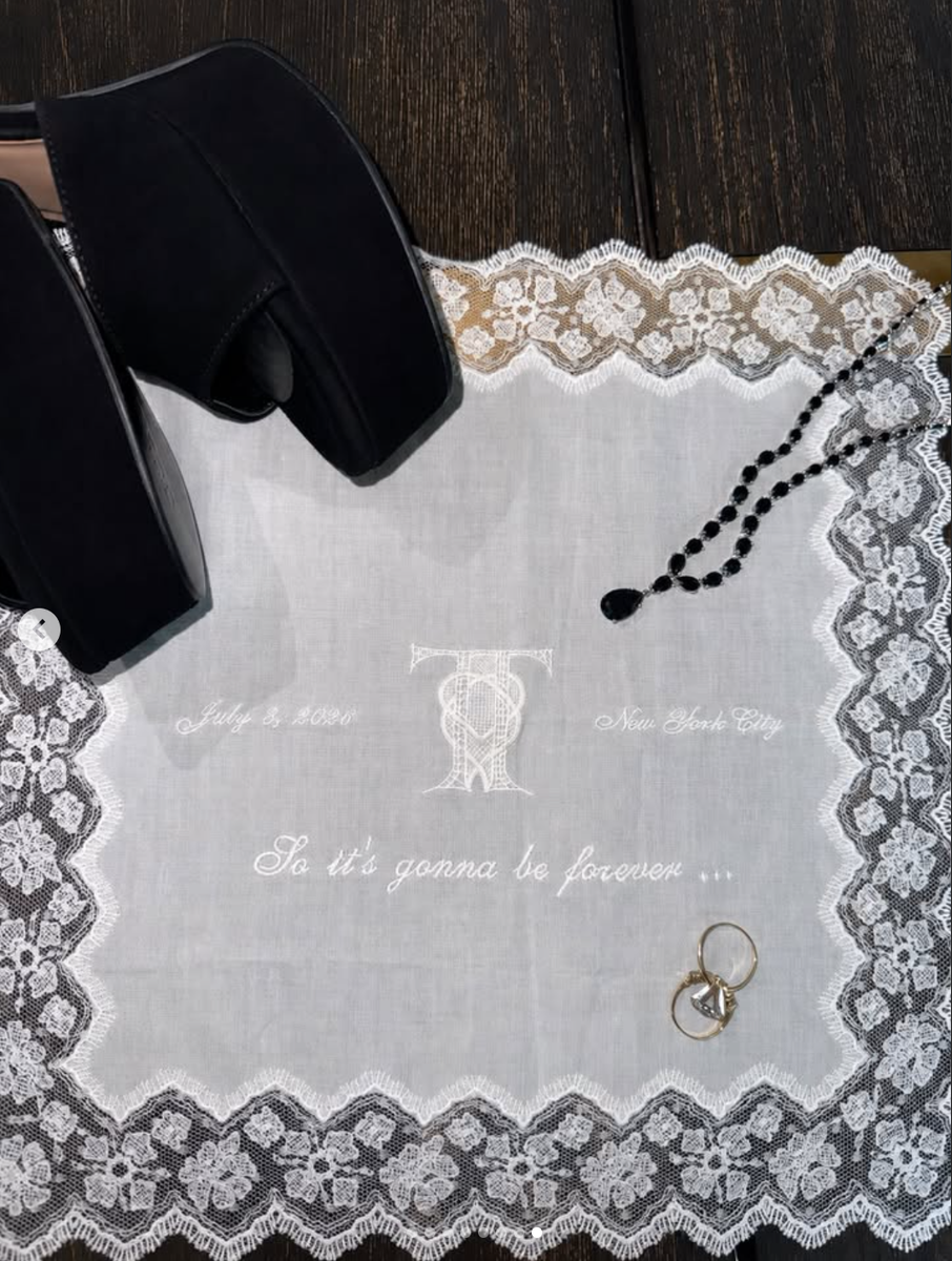 The couple prepared guests with custom embroidered handkerchiefs placed at every seat. The keepsakes featured an interlocking "TT" heart logo alongside a lyric from Swift's 2014 hit "Blank Space"