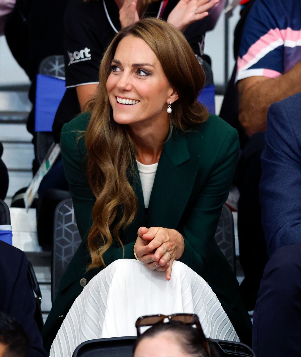 Kate accessorized her looks with some jewelry that nod at the royal family's history and future