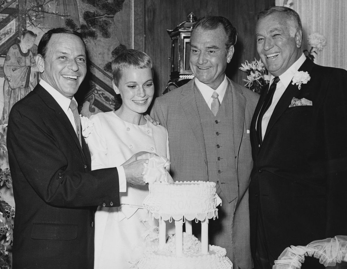 19th July 1966:  Actor and singer Frank Sinatra with actress Mia Farrow on their wedding day at Las Vegas with Red Skelton.    (Photo by Alan Band/Keystone/Getty Images)