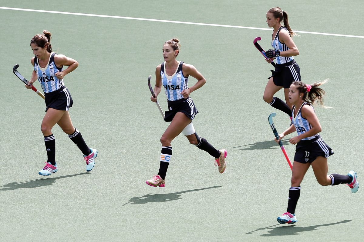 Luciana Aymar (2nd L) of Argentina celebrates her goal with her teammates during the Field Hockey World Cup women's tournament match between the USA and Argentina in The Hague, the Netherlands, on June 14, 2014. 
