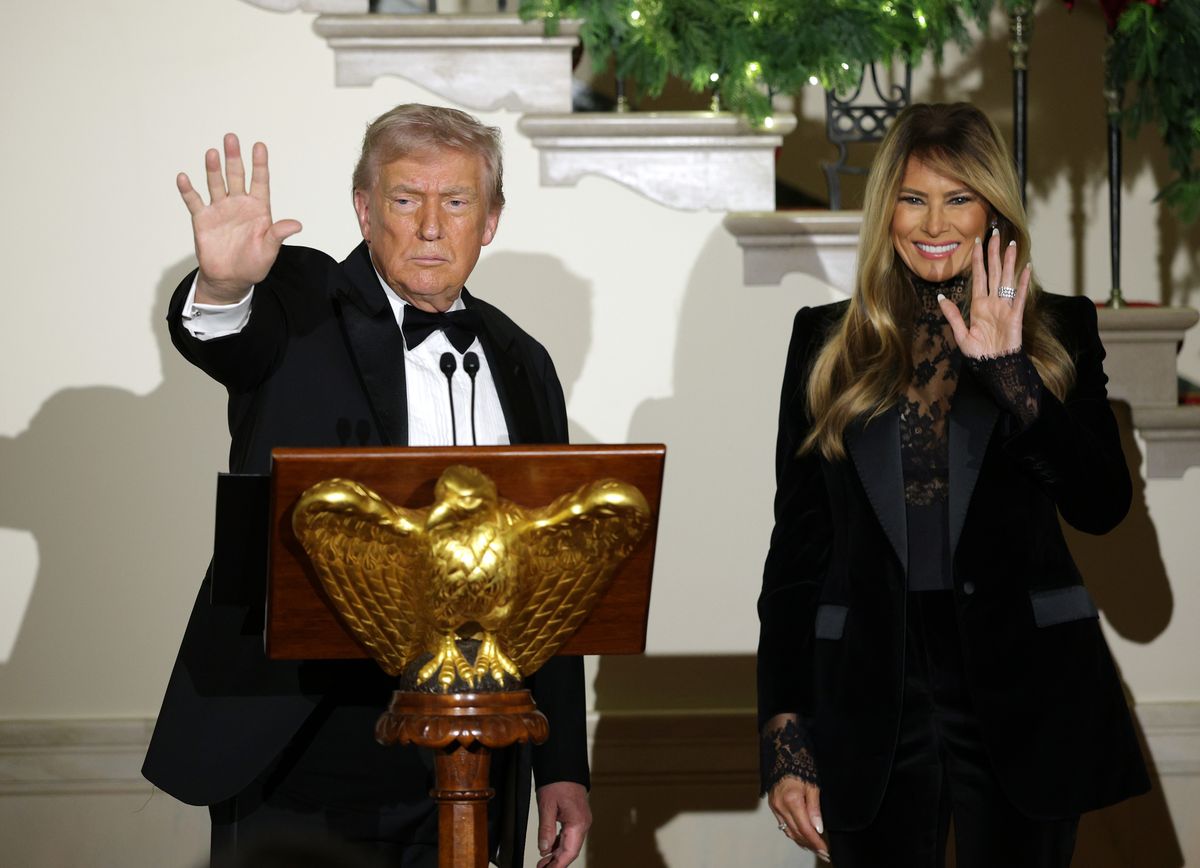 Melania Trump wore a black velvet Dolce & Gabbana single-breasted blazer, sharply nipped at the waist, paired with matching tailored cigarette trousers.