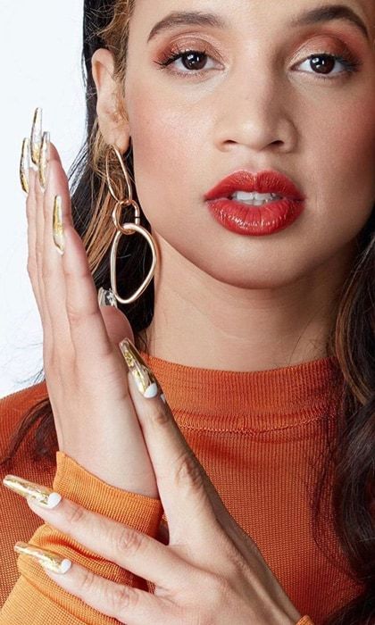 Dascha Polanco Orange Nails