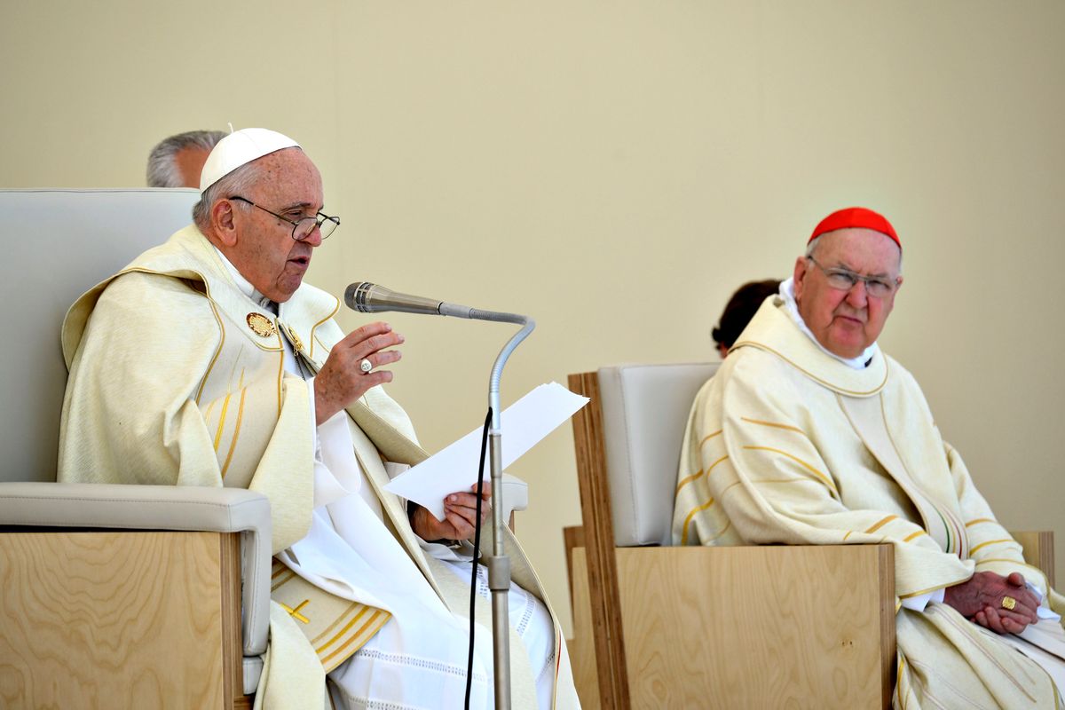 Pope Francis, flanked by cardinal Kevin Joseph Farrell (R) attends the Mass for the 37th World Youth Day at Parque Tejo on August 06, 2023 in Lisbon, Portugal. 