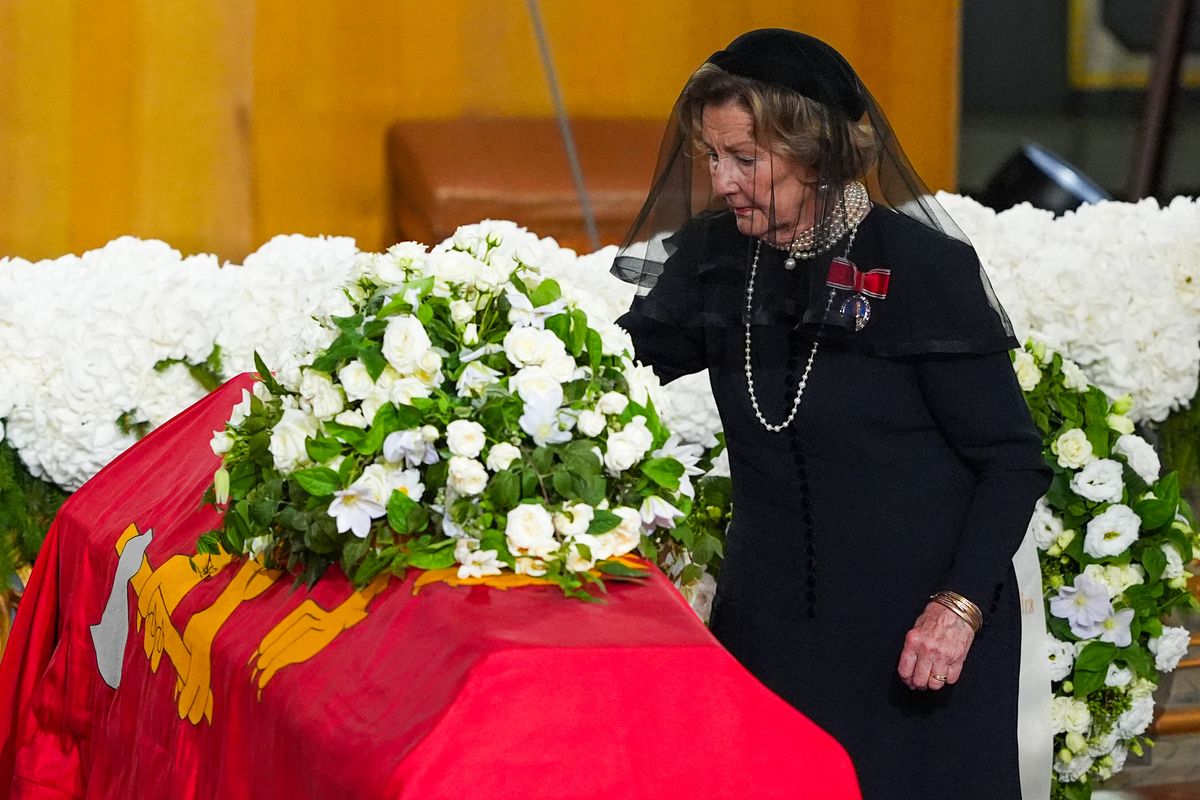 Norway's Queen Sonja places a rose on the coffin of her late husband, King Harald V, during his state funeral ceremony at Oslo Cathedral in Oslo, Norway, on September 9, 2026.