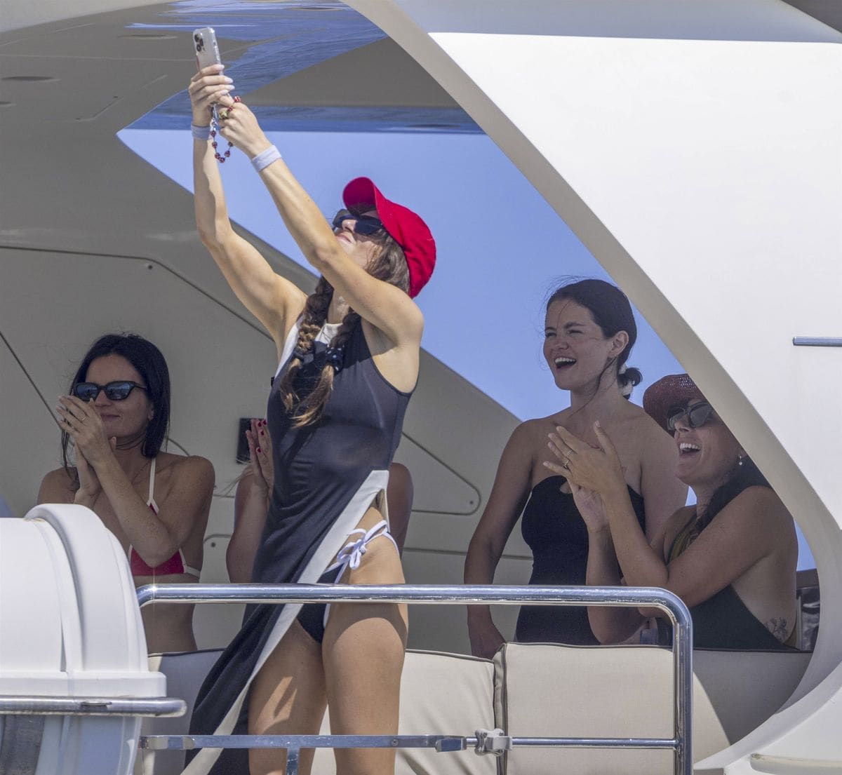 Selena Gomez stunned in a black swimsuit as the group sipped cocktails, danced, and snapped selfies.