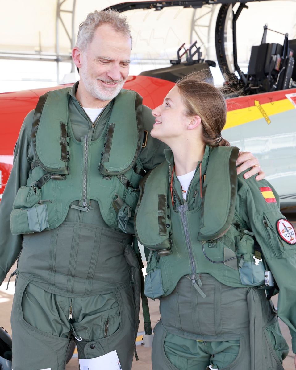Smiles all around as King Felipe VI congratulates Princess Leonor after their historic flight together.