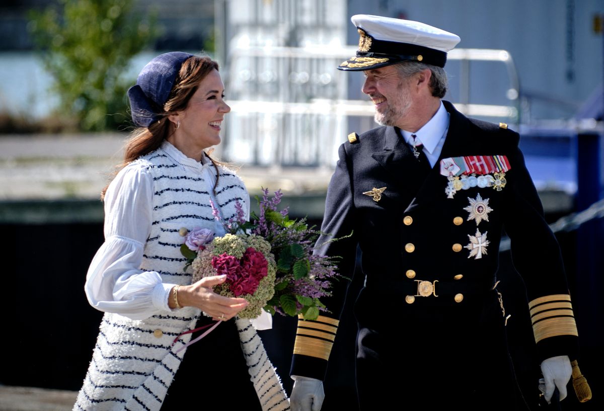 King Frederik X of Denmark (R) and Queen Mary of Denmark react as they arrive in the habour of Roenne for their visit of Bornholm Regional Municipality, on the Danish island of Bornholm in the Baltic Sea, on August 19, 2024. (Photo by Pelle Rink / Ritzau Scanpix / AFP) / Denmark OUT (Photo by PELLE RINK/Ritzau Scanpix/AFP via Getty Images)