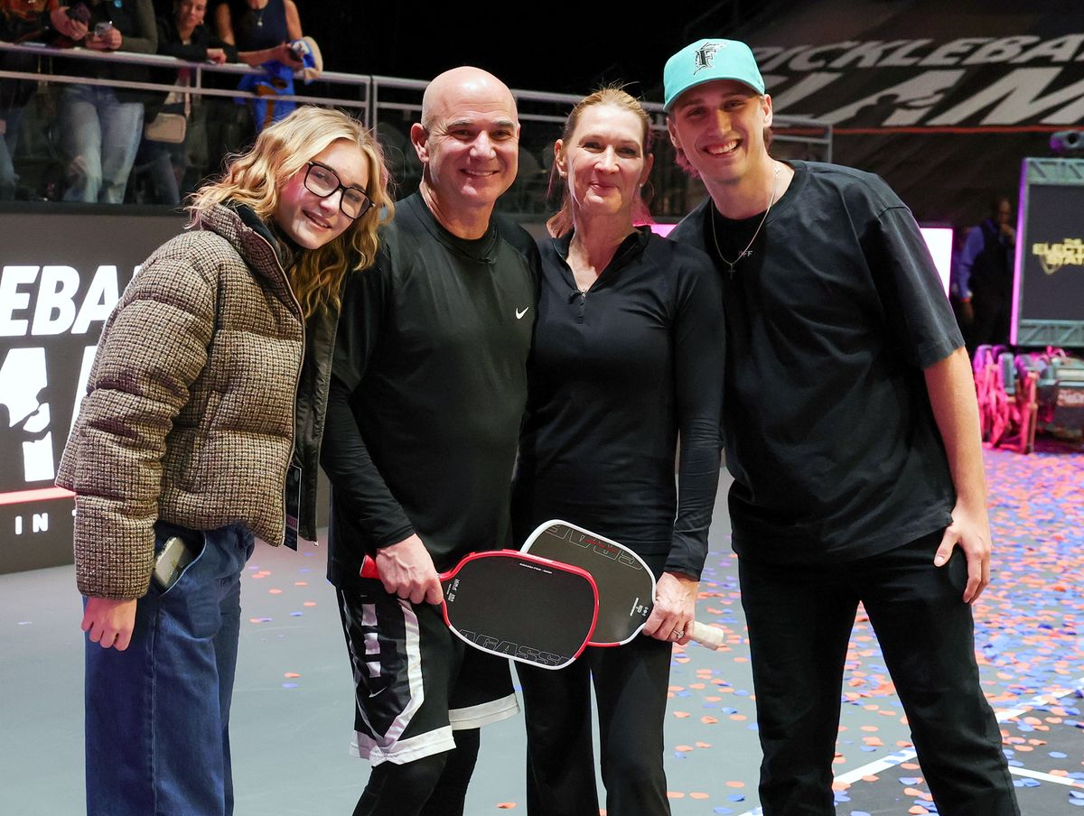 (L-R) Jaz Agassi, Andre Agassi, Steffi Graf and Jaden Agassi pose on the court after Andre Agassi and Graf won the Pickleball Slam 3 championship. 