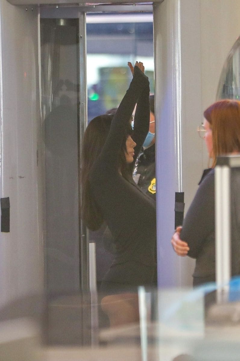 Bianca dressed up for the flight and was seen in a long-sleeved jumpsuit that showed off her legs with peep-toe knee-high white boots and a cap.