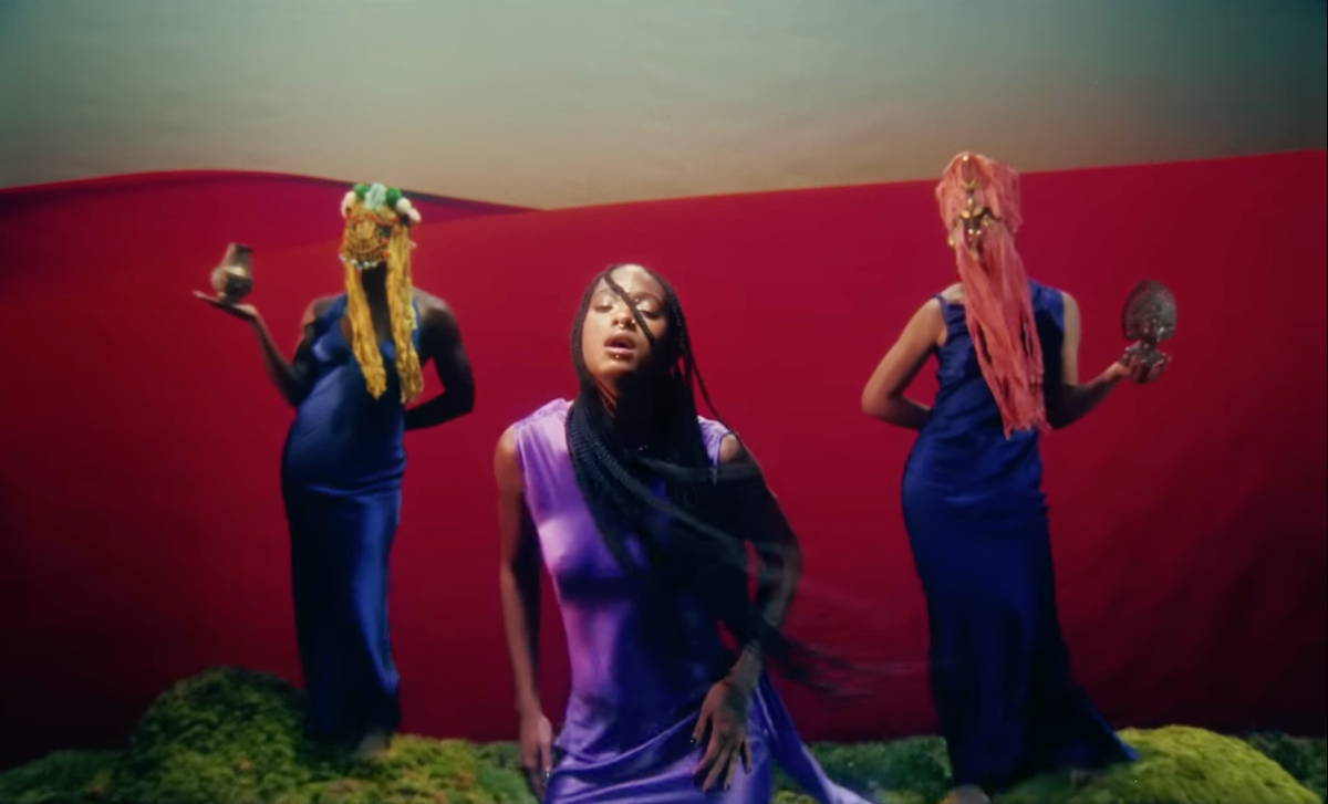 WILLOW embraced divine femininity in a luminous purple satin gown while unveiling the visuals for her new single, 'Talk on the Hill'