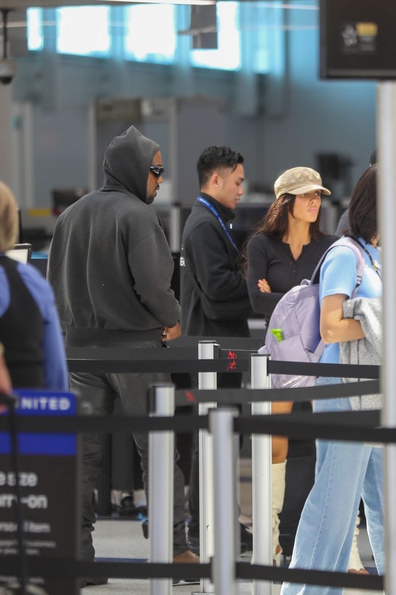 Kanye West and Bianca Censori are spotted making their way through LAX ahead of a commercial flight
