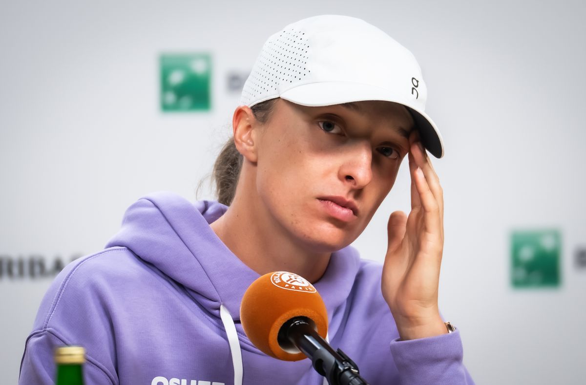 Iga Swiatek of Poland talks to the media after losing to Marta Kostyuk 