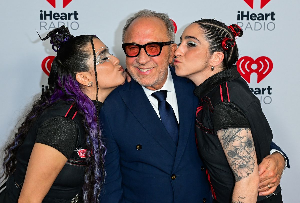 Cuban-US musician and film producer Emilio Estefan (C) poses with his daughter singer Emily Estefan (R) and her partner  Gemeny Hernandez (L).