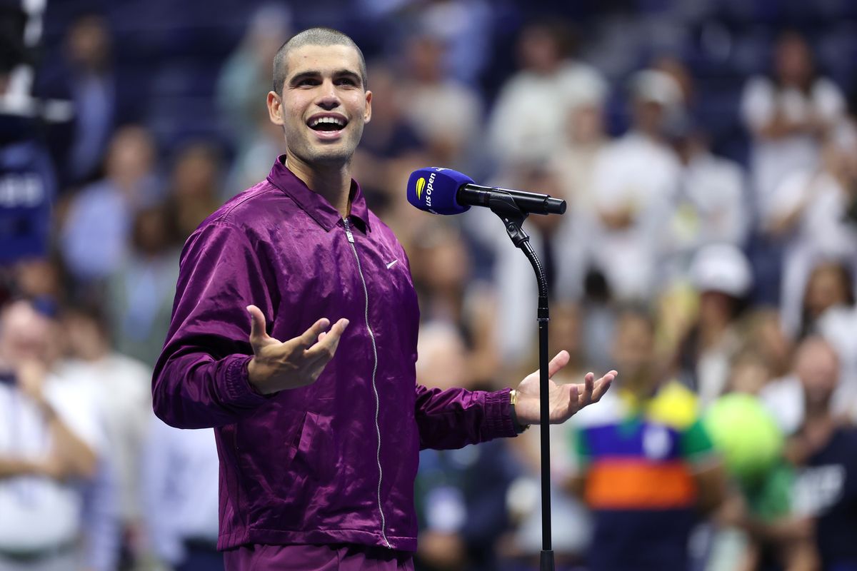  Carlos Alcaraz of Spain speaks to the crowd after defeating Reilly Opelka of the United States during their Men's Singles First Round match on Day Two of the 2025 US Open 