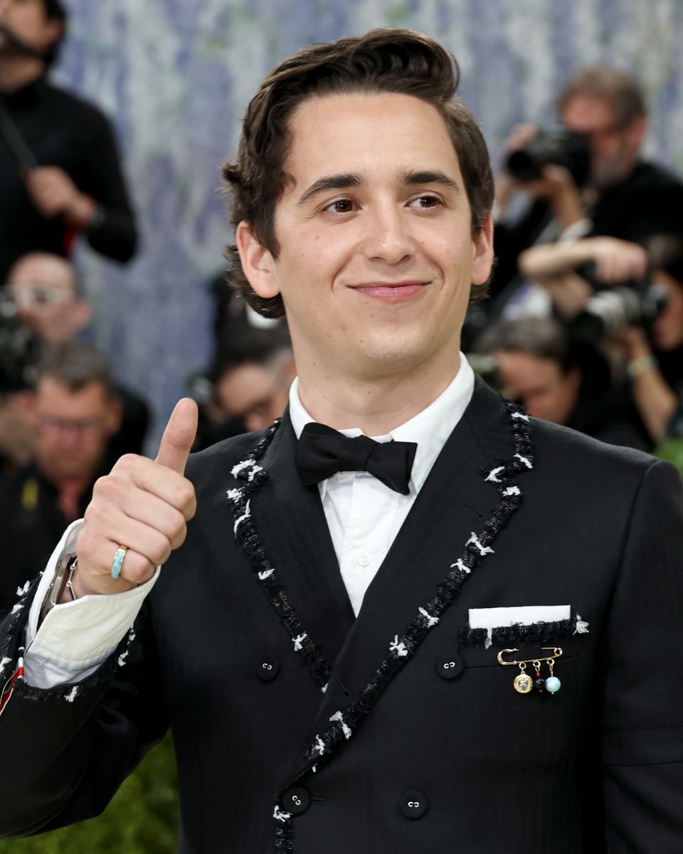His jacket had a decorative brooch that honored his culture  