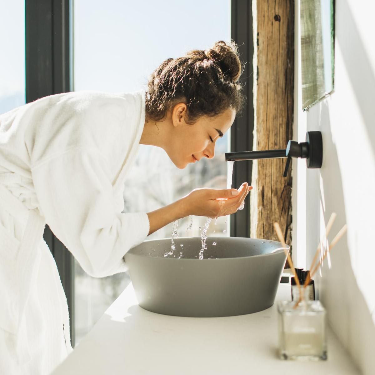 woman washing face