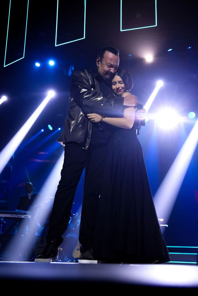 Pepe Aguilar and Angela Aguilar embrace onstage during the Latin Recording Academy Person of The Yea