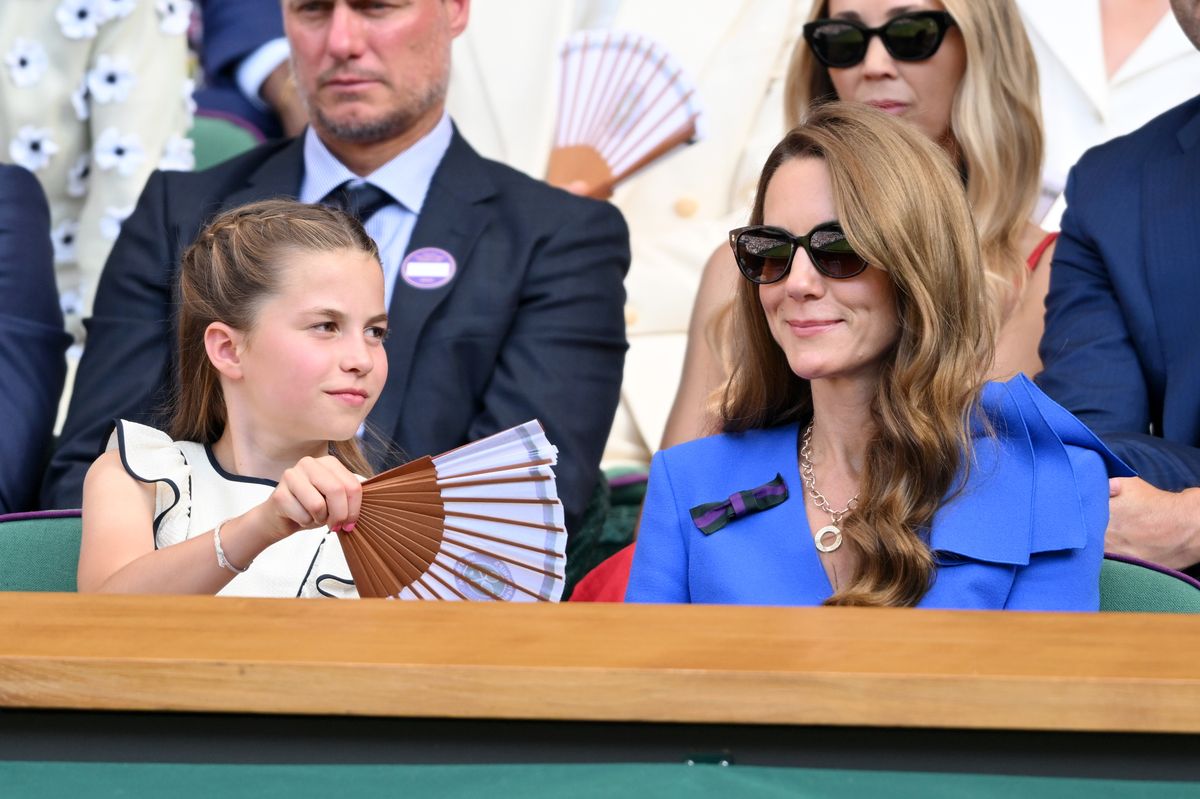 Princess Charlotte waving her fan towards her mother