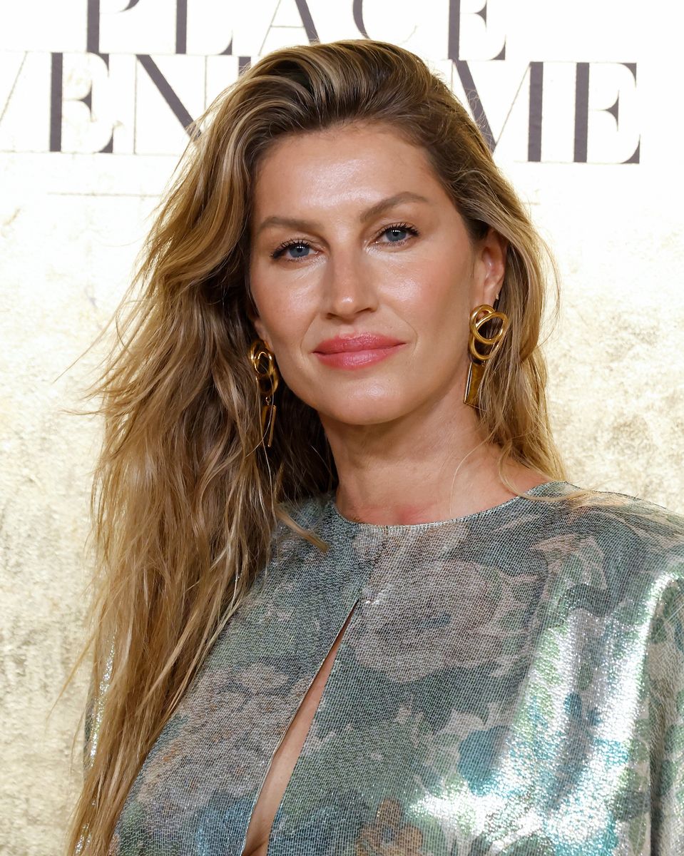 For the occasion, Bündchen stepped out in a striking silver gown featuring a thigh-high slit and a daring cutout at the chest