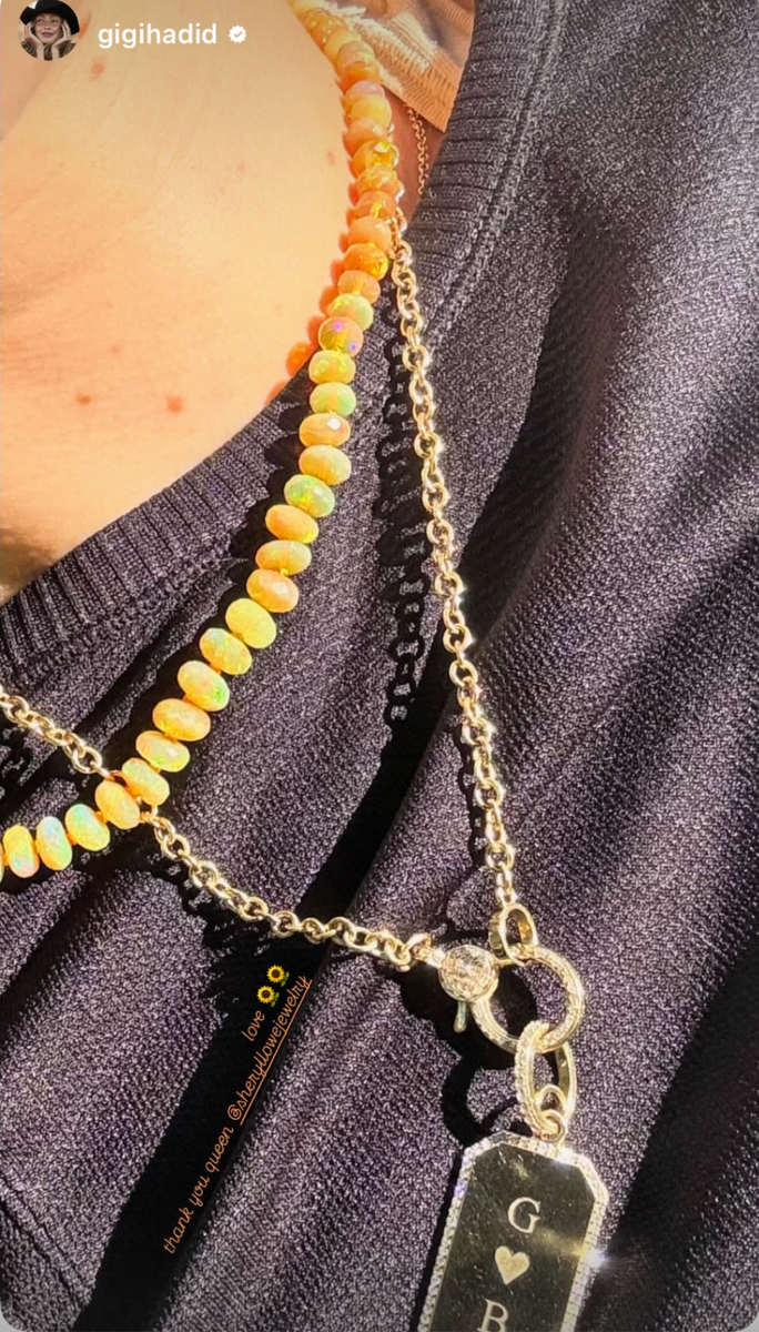 Gigi showed off the piece of jewelry dedicated to her man 
