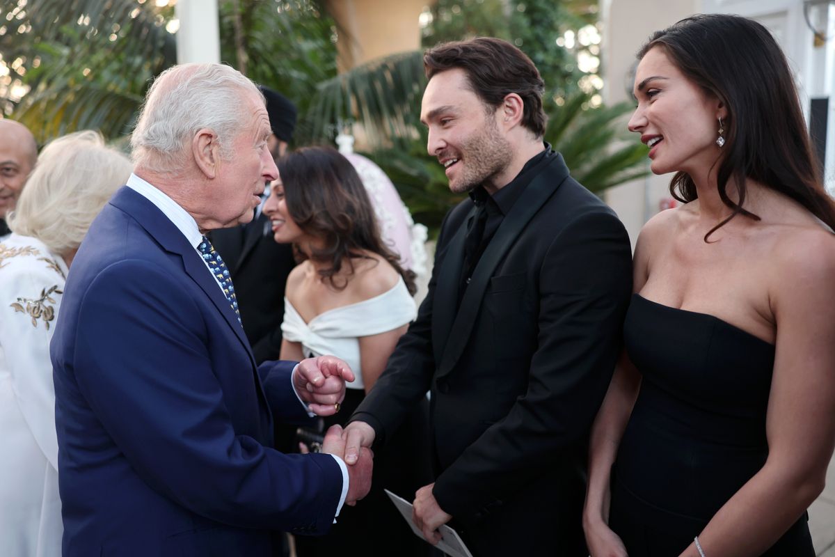 LONDON, ENGLAND - MAY 13: King Charles III meets Ed Westwick and Amy Jackson at The Elephant Family Evening of Art and Conservation at Kew Gardens on May 13, 2025 in London, England. Established by Queen Camillaâs brother Mark Shand in 2002, The Elephant Family works in partnership with conservation experts on the ground to tackle the challenges facing Asiaâs wildlife and the communities that live alongside it. (Photo by Chris Jackson/Getty Images)