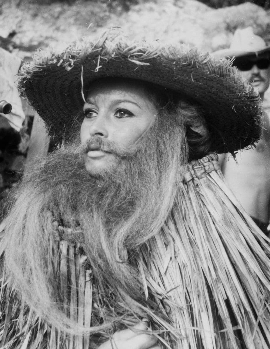 Sporting her combat outfit for one of the key scenes of 'Viva Maria,' Bardot is caught by the camera between takes on location in Mexico.