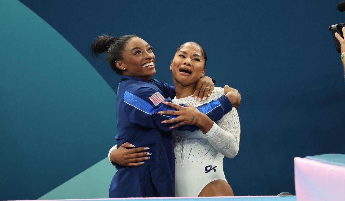 Silver medalist Simone Biles (L) and bronze medalist Jordan Chiles (R) of Team United States celebrate after competing the Artistic Gymnastics Women's Floor Exercise Final.